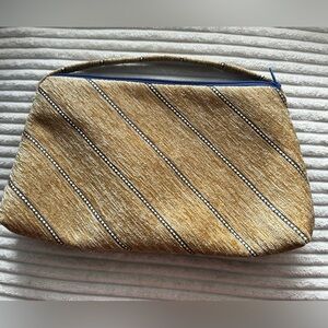 Tan Clutch Purse With Blue Trim And Small Handle